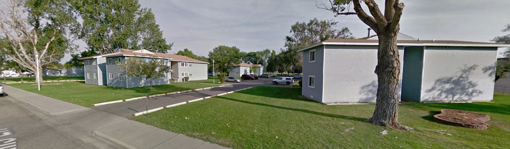 a row of houses on the side of a street