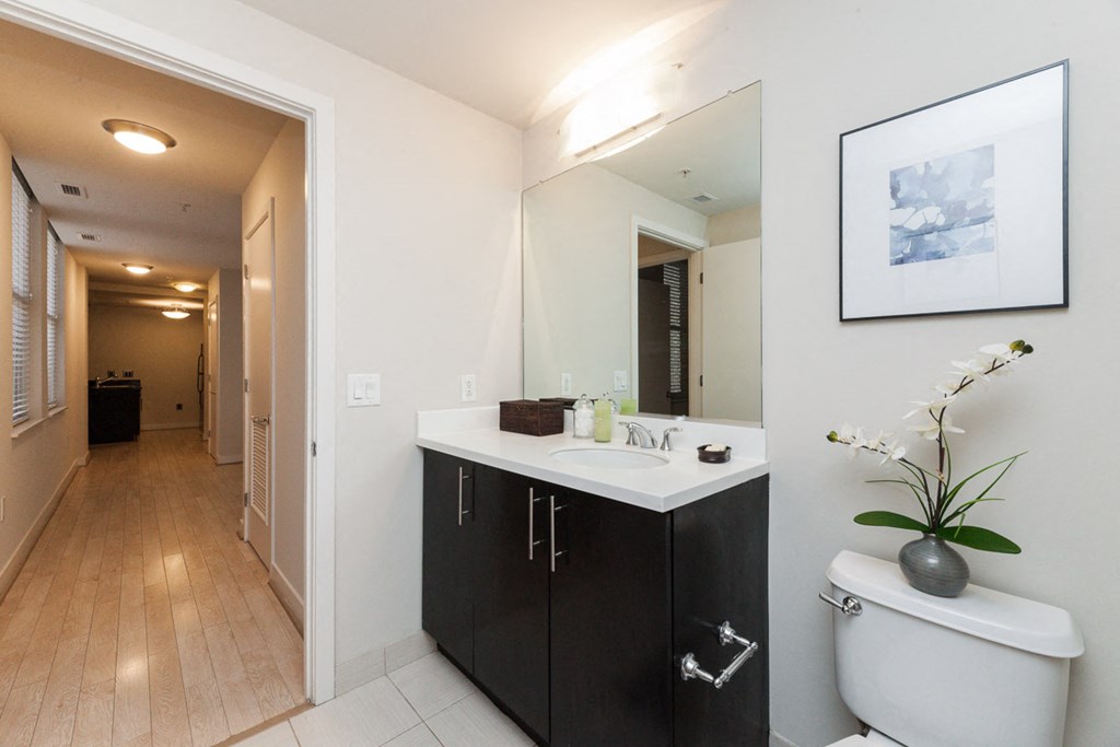Renovated Bathrooms With Quartz Counters at The Woodward Building Apartments, Washington, DC 20005