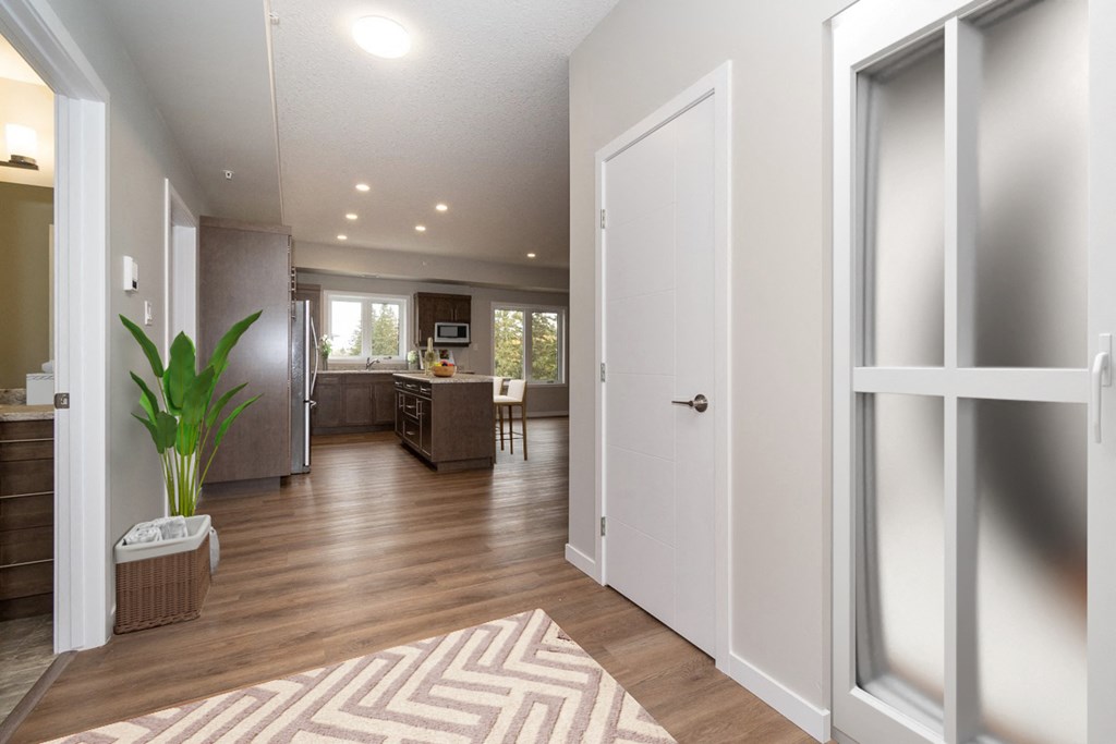 a view of a living room and kitchen from a door