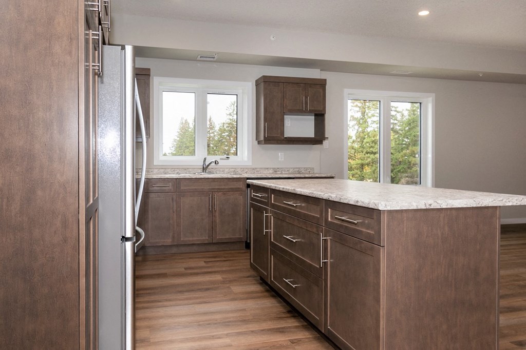 a kitchen with wooden cabinets and a counter top