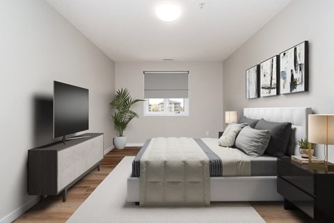 an image of a bedroom with a bed and a tv