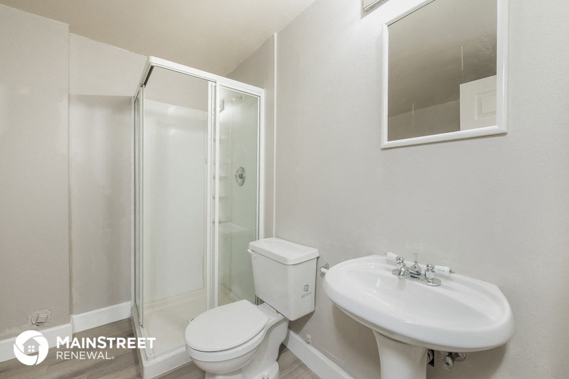 a bathroom with a sink toilet and a shower