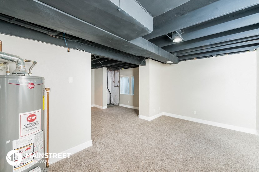 a basement with a water tank in the middle