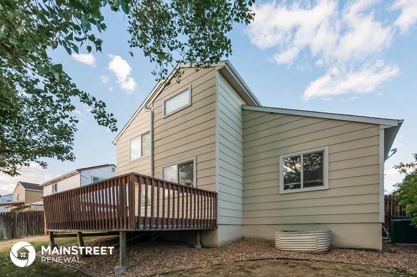 the exterior of a house with a porch and a deck