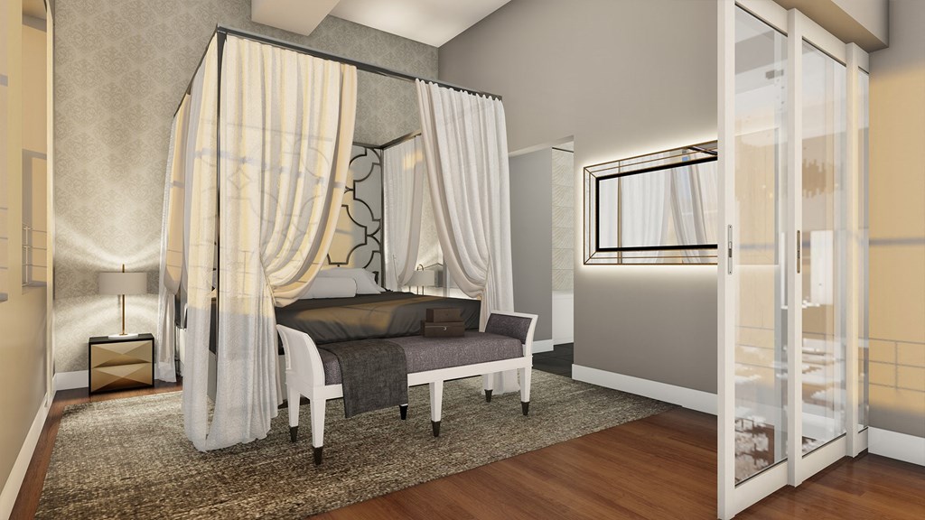 a bedroom with a bed and a glass door