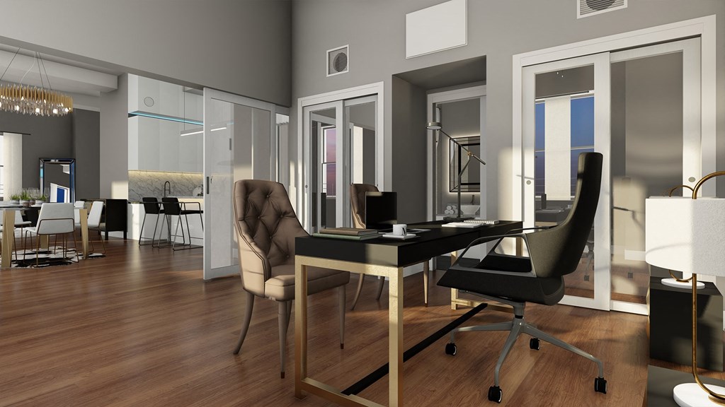 a home office with a desk and chairs