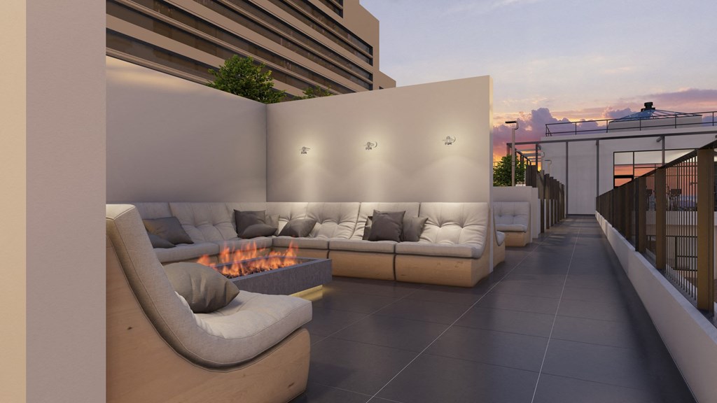 a rendering of a patio with couches and a fire pit