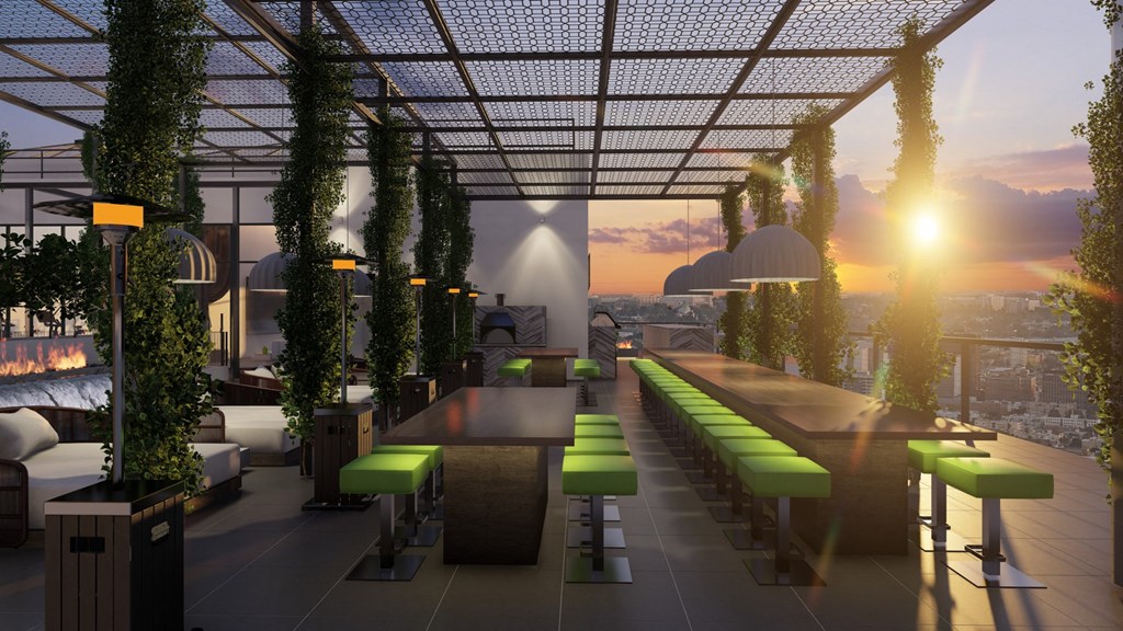 a rendering of a rooftop restaurant with a sunset in the background