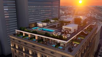 a rendering of a building with a pool on top of a skyscraper