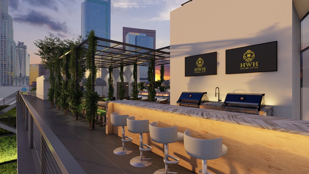 a bar with a wooden counter and chairs in front of a building