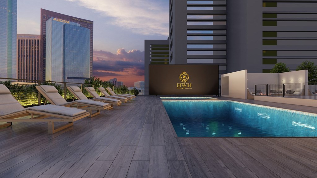 a swimming pool on the roof of a skyscraper