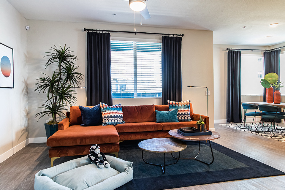 a living room with a couch and a table