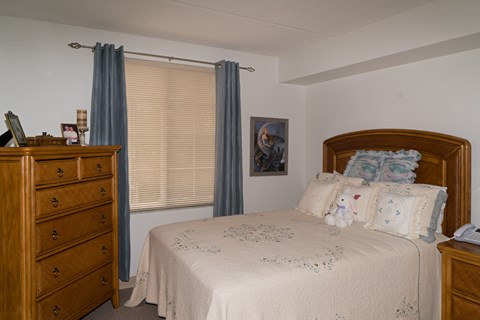 spacious bedroom with large window at Villa San Marcos