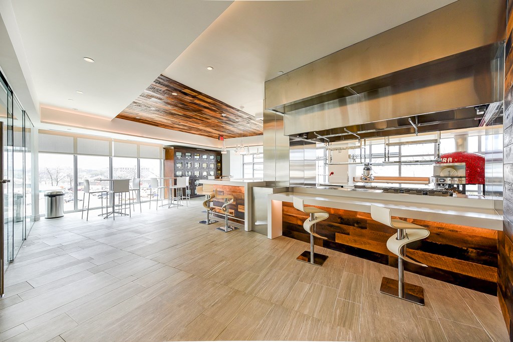 a large kitchen with a large counter and a large window