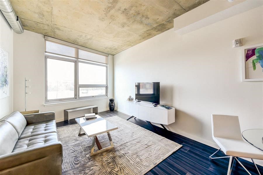 a living room with a couch and a tv