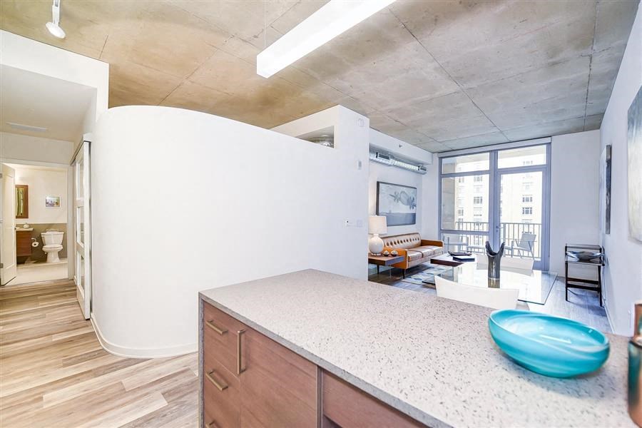 a kitchen with a view of a living room