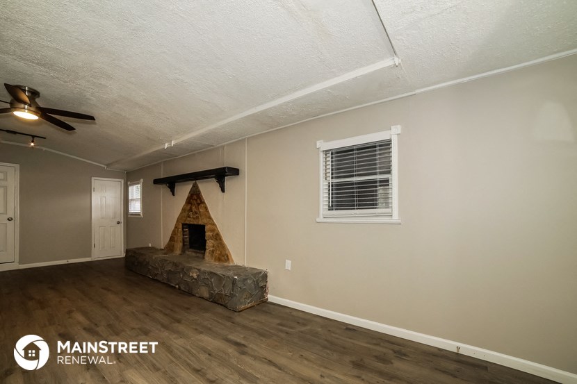the living room of a home with a fireplace
