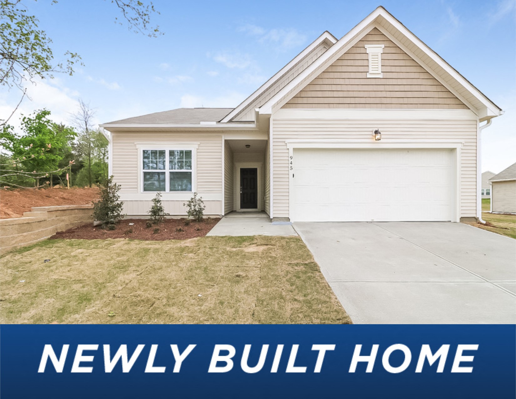 a white house with a lawn and a driveway newly built home