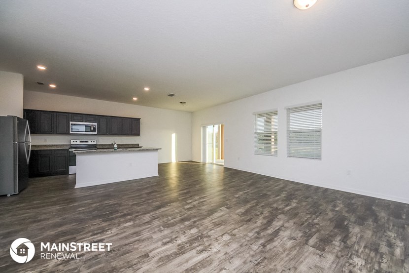 the living room and kitchen are spacious and ready for guests to use