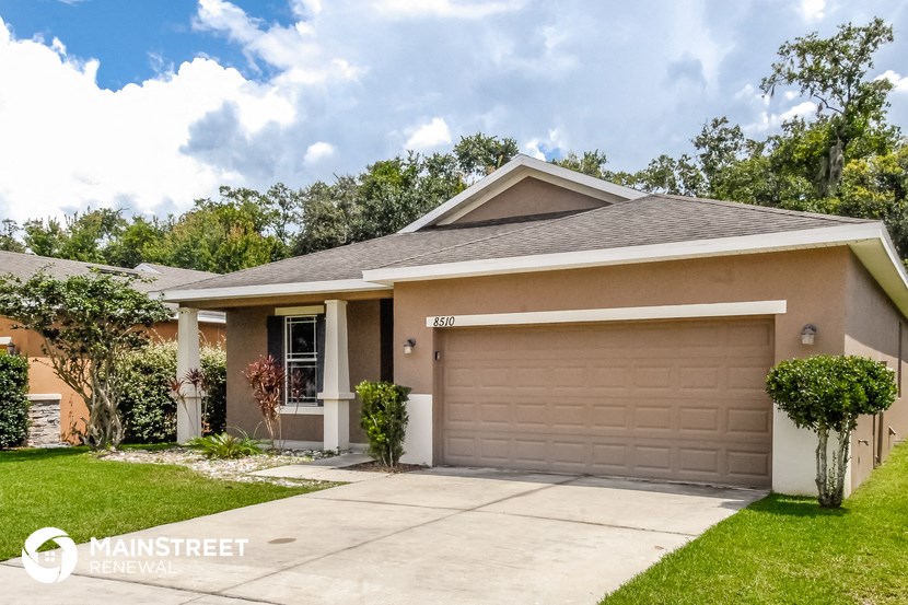 a house with a driveway and a garage door