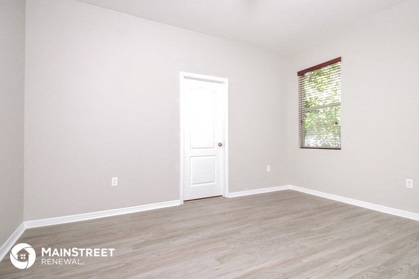 the master bedroom  nathan residence  white door  wood flooring