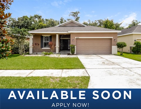 a suburban house with a lawn and a driveway