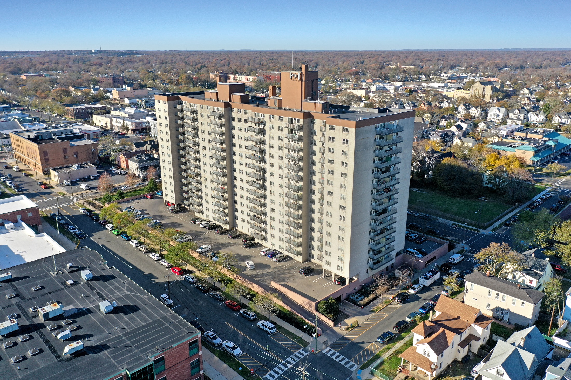 A large building with a parking lot in front of it.