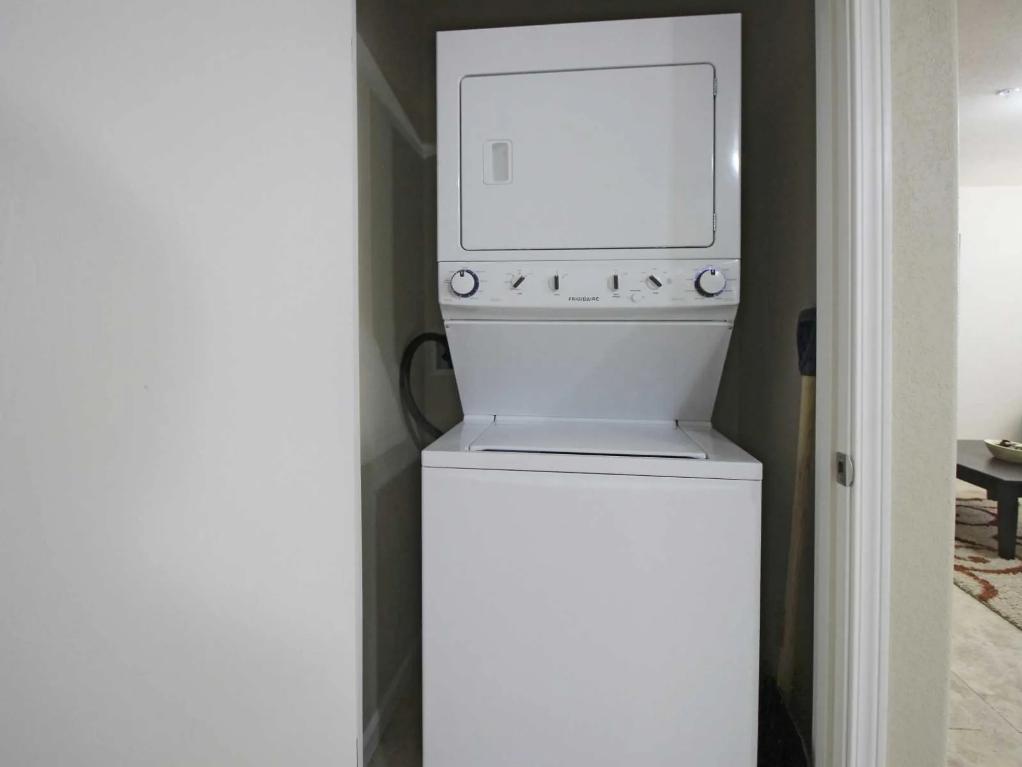 a white washer and dryer in a white room