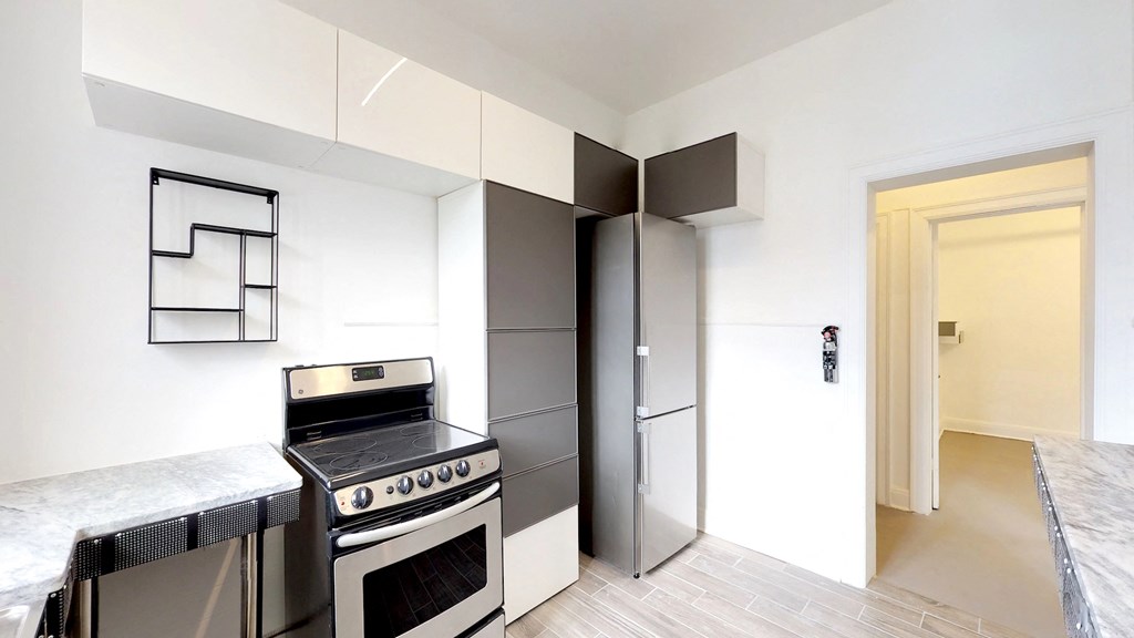 a kitchen with a stove and a refrigerator