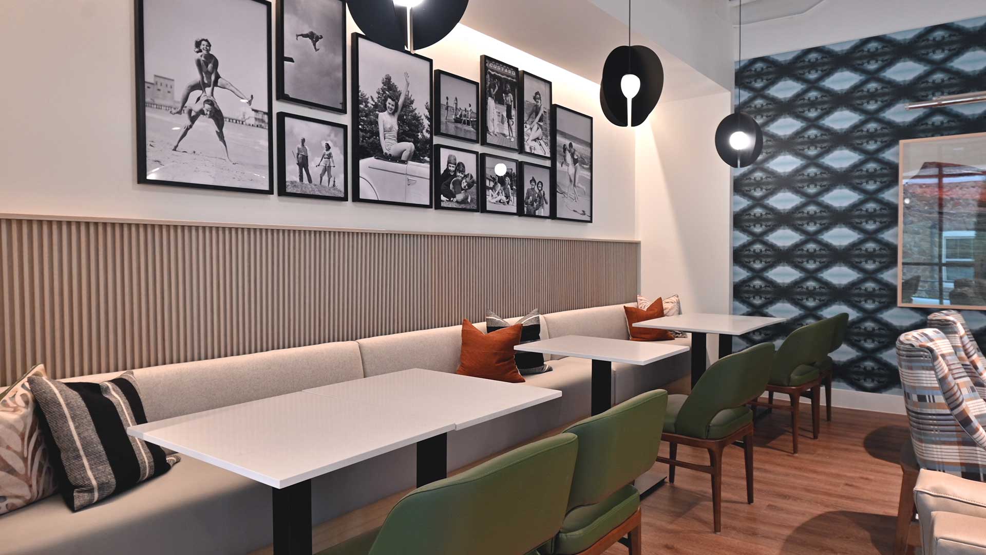 A dining area with bench seating along the wall and chairs facing.