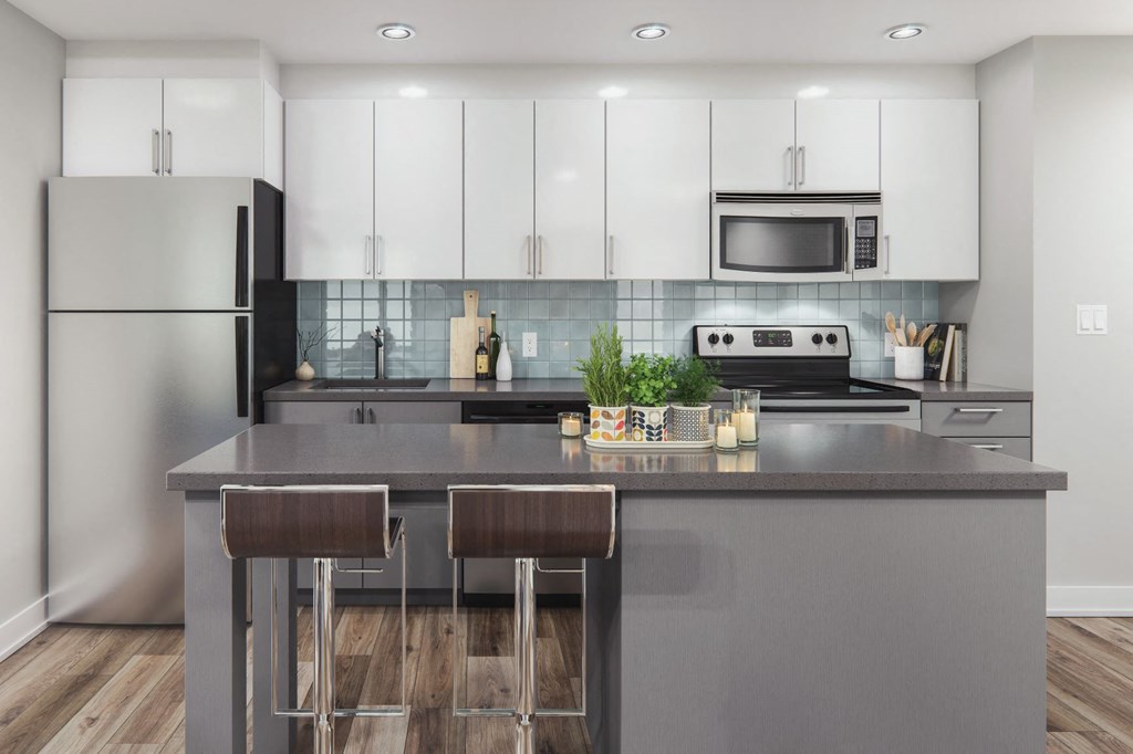 a kitchen with white cabinets and a counter top