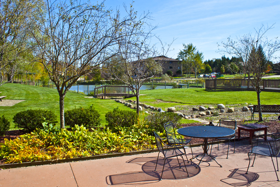 Patio overlooking the pool and pond at  Integrity Medina Apartments, Integrity Realty LLC, Medina