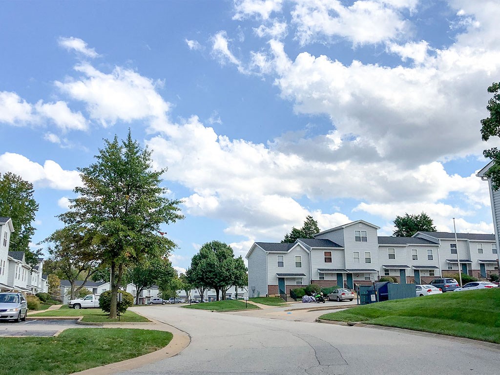 a street with houses on the side of a road