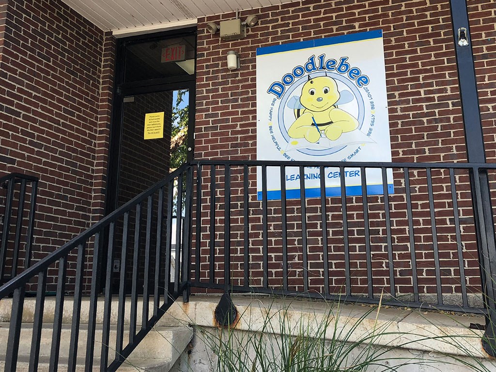 a sign on the side of a brick building