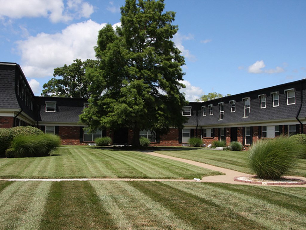 the lawn in front of an apartment building
