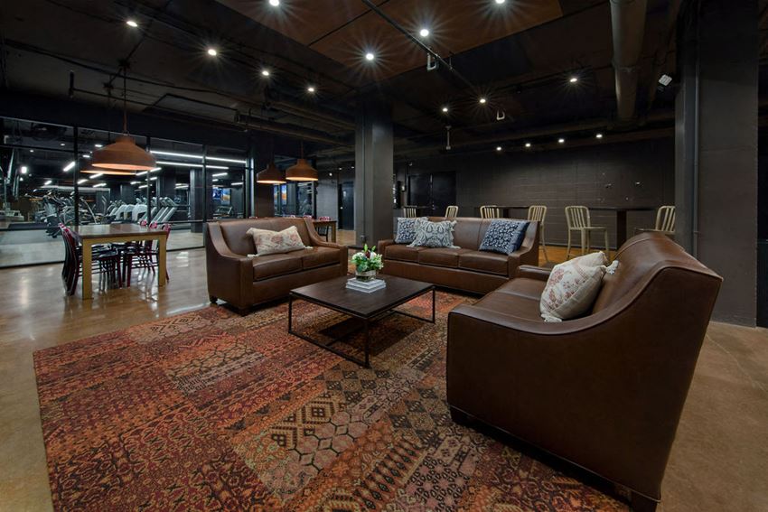 a living room with couches and a table