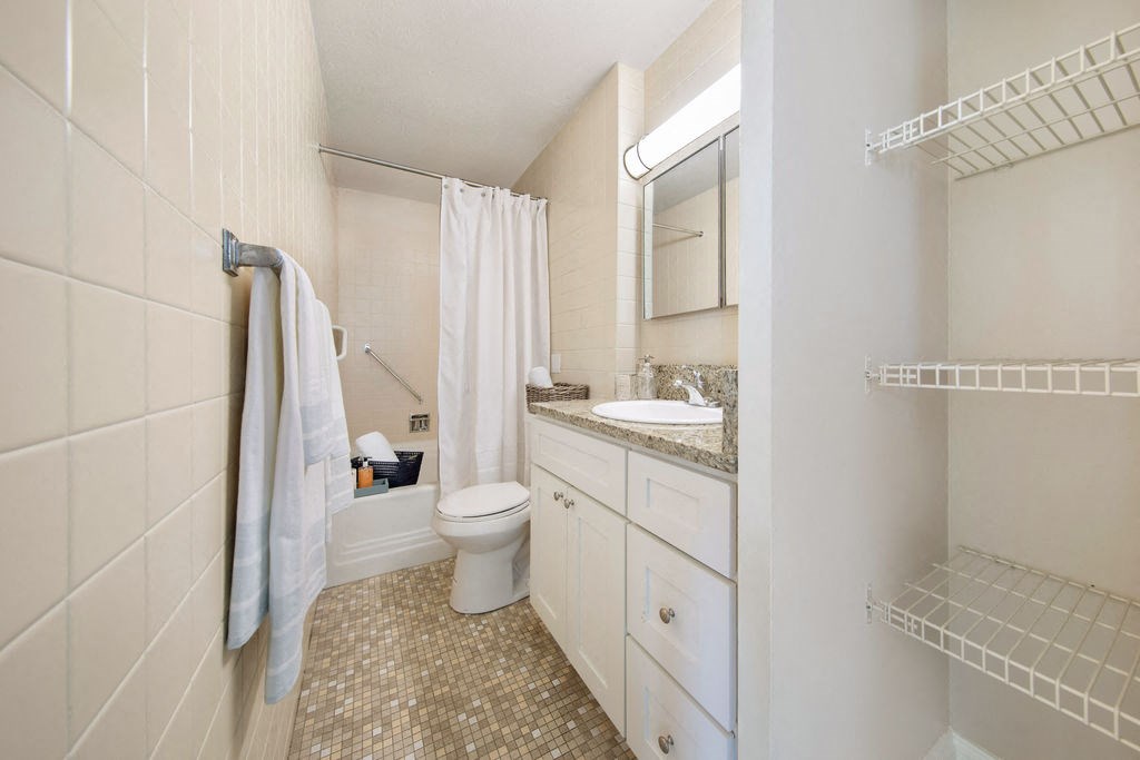 a bathroom with a sink toilet and a shower
