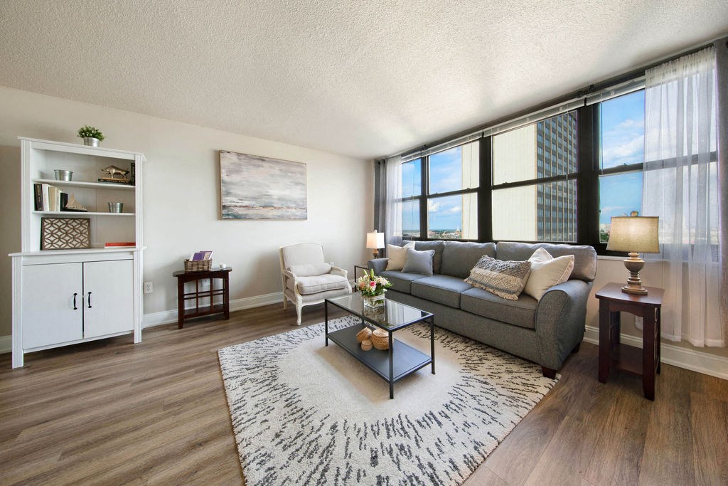 an open living room with a couch and a table