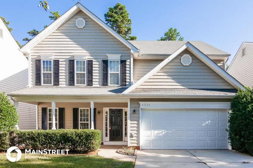 a blue house with a white garage door