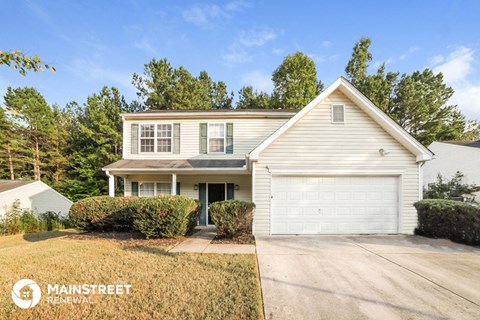 a white house with a white garage door