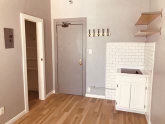 a small bathroom with a sink and a door to a closet