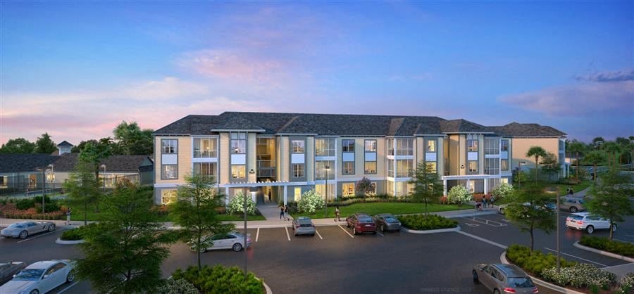 a rendering of an apartment building in a parking lot