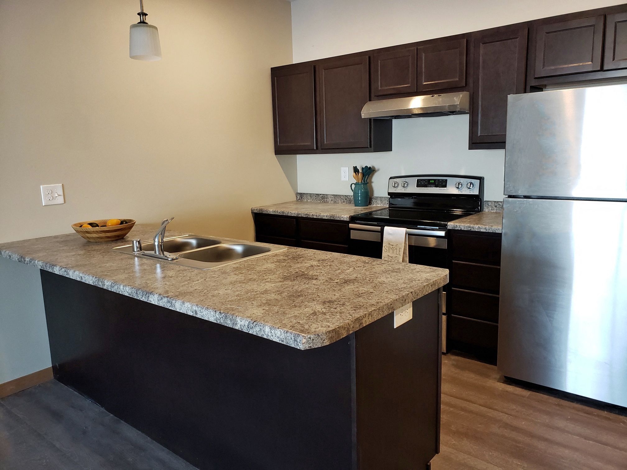 a kitchen with stainless steel appliances and granite counter tops