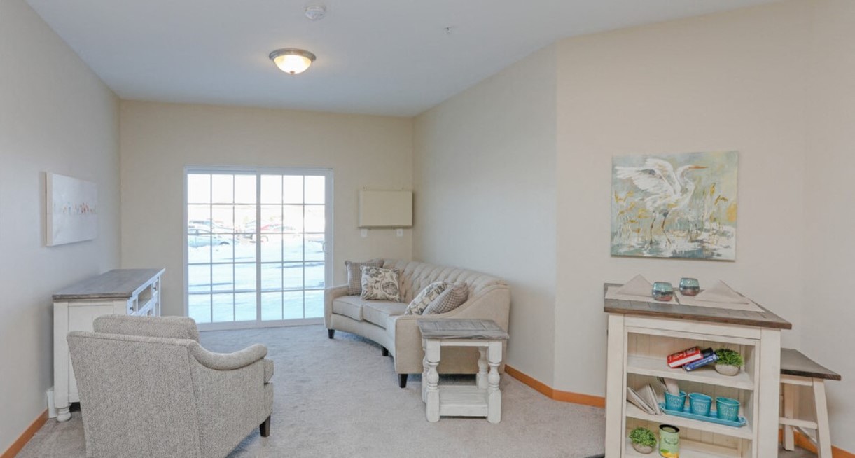 a living room with two couches and two chairs and a table