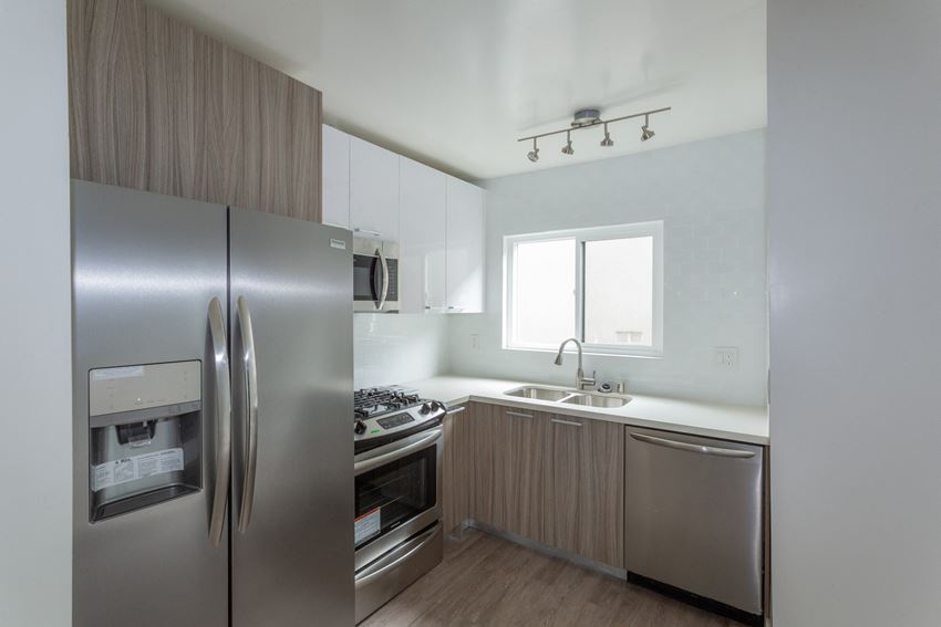 Apartments in Hollywood Los Angeles for Rent - Gracie on Gramercy - Kitchen and Living Room Area with In-Unit Washer and Dryer - Photo Gallery 1