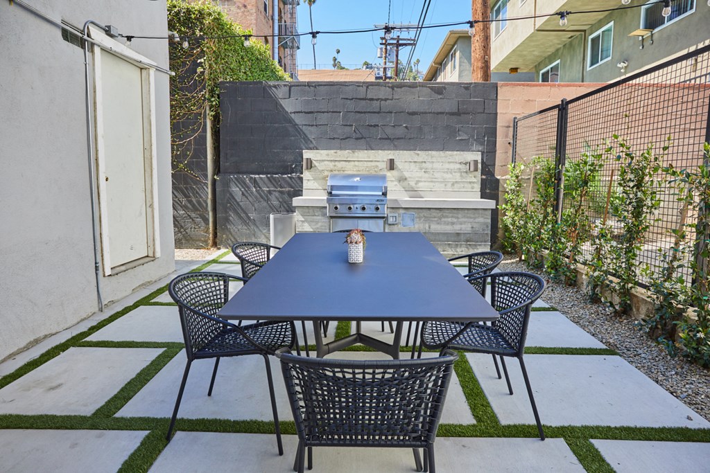 Outdoor Lounge with Table and BBQ