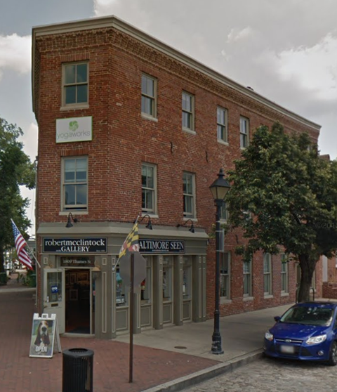 an old brick building on the corner of a street