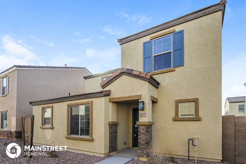 a house with a sidewalk in front of it