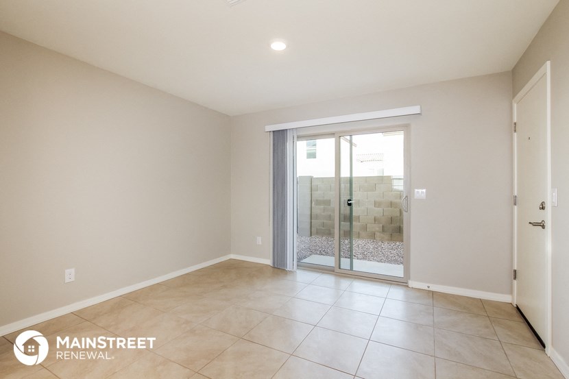 a master bathroom with a shower and a tiled floor and a sliding glass door