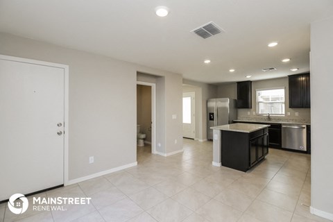 the kitchen and living room are spacious and open to each other